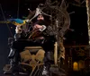 The image features a vibrant pirate-themed performance with acrobats ships and action set against a backdrop with a pirate ship and ocean alongside an inset of a plate with a meal including chicken corn and beans